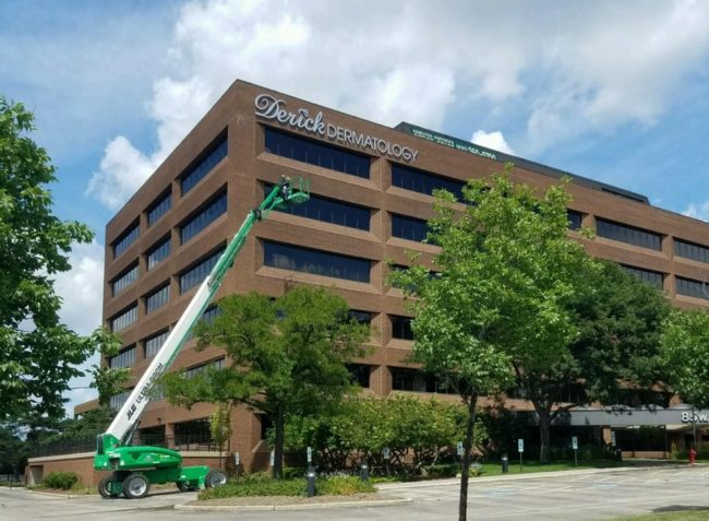 outside picture of arlington heights location, crane, trees